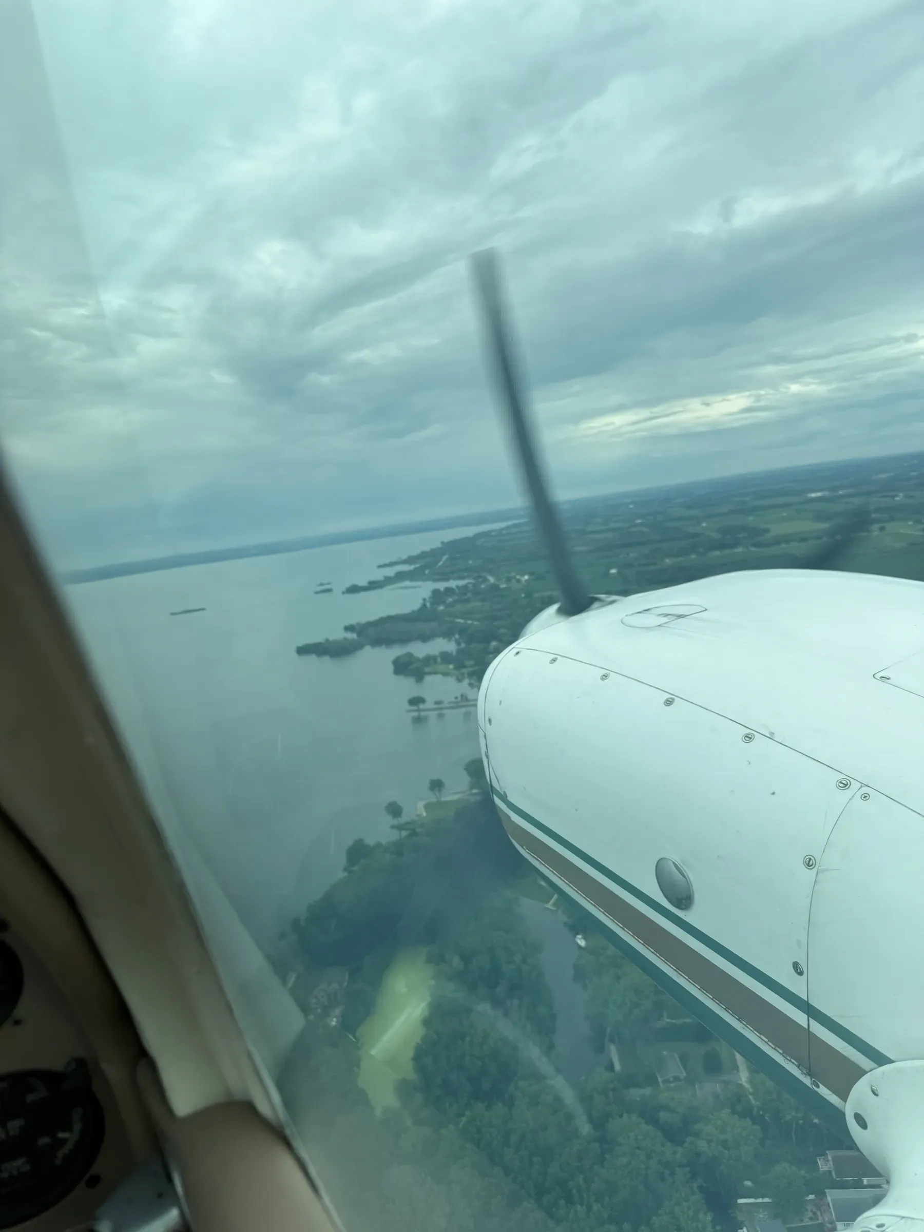 On the FISK arrival into Oshkosh, over Lake Winnebago under a low overcast