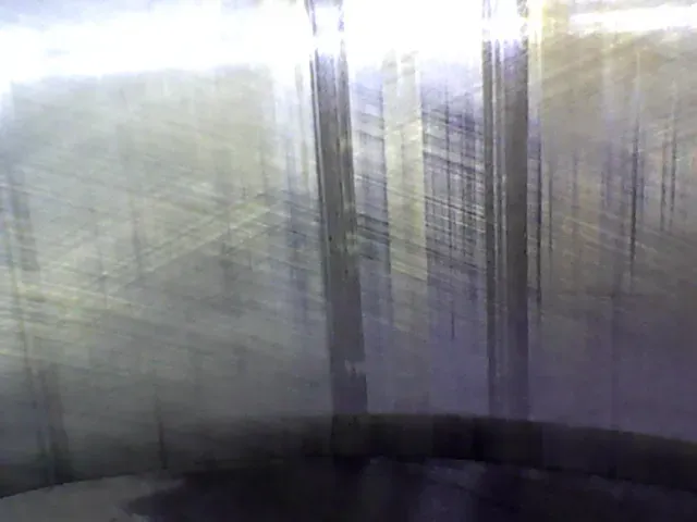 Borescope view of a cylinder wall showing deep vertical scoring cut by a piston pin dragging against the wall